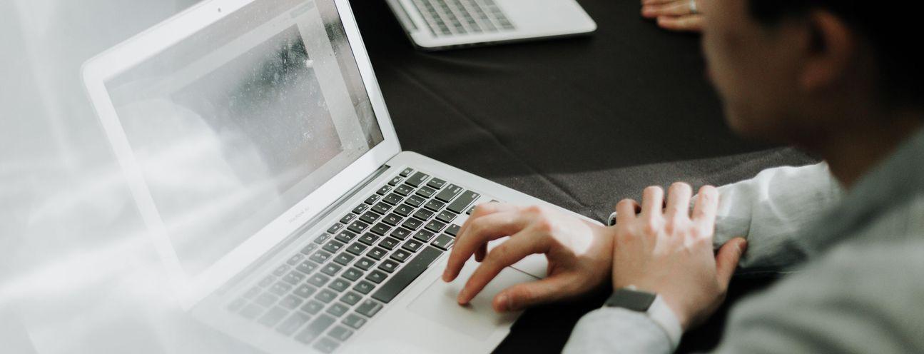 Man typing on laptop