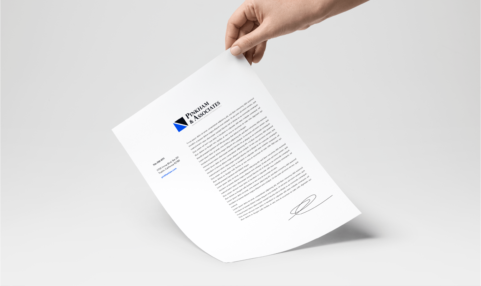 a person's hand holding a piece of paper